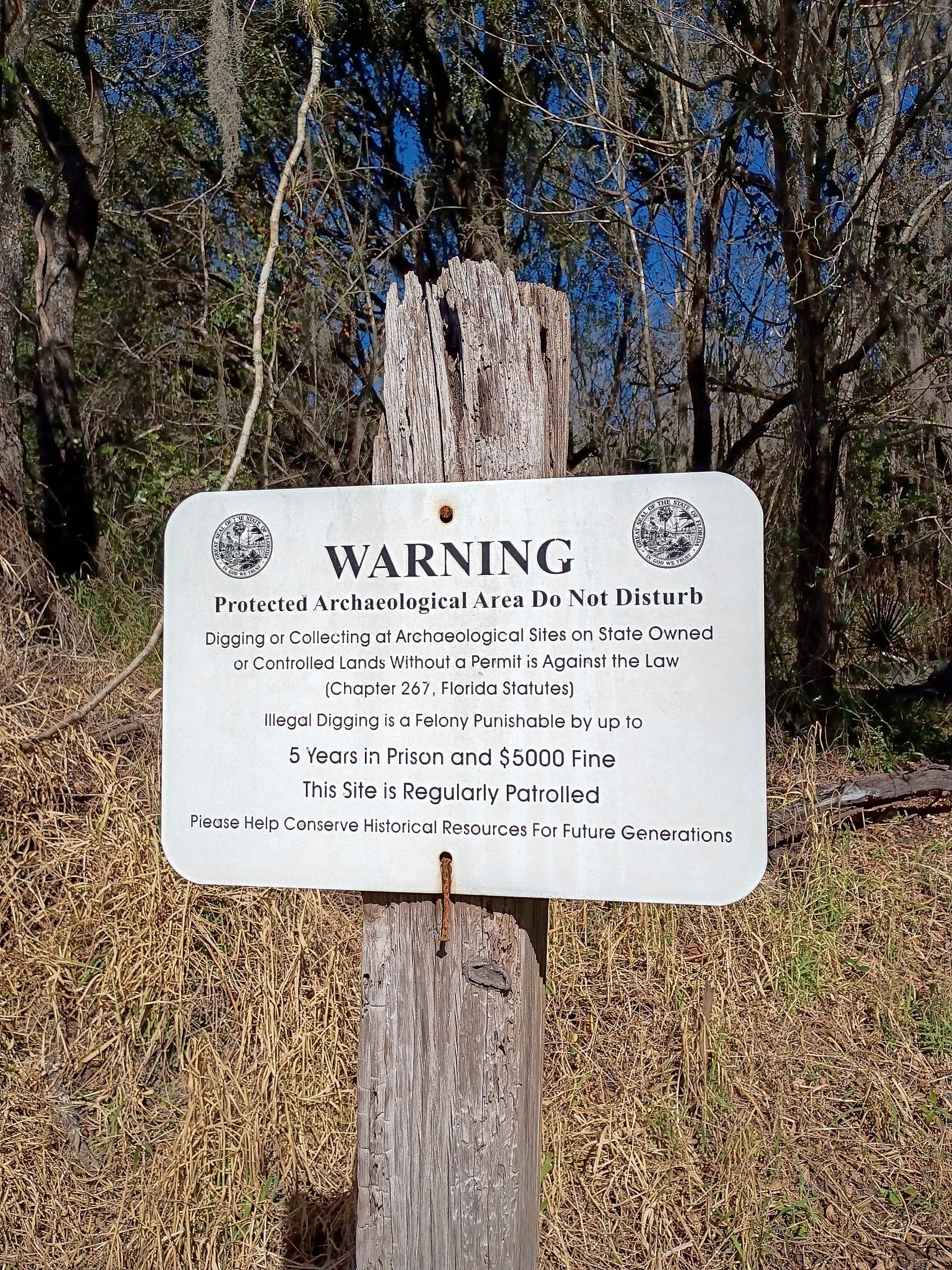 Warning sign at Kissengen Spring archaeological site, Polk County Florida — Protected Archaeological Area Do Not Disturb