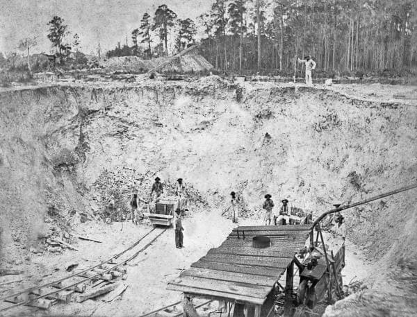Early phosphate mining pit in Polk County, Florida — hand excavation in the Bone Valley Formation, late 1800s