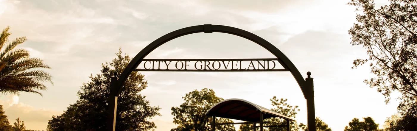 The City of Groveland arch at the lakefront park at sunset