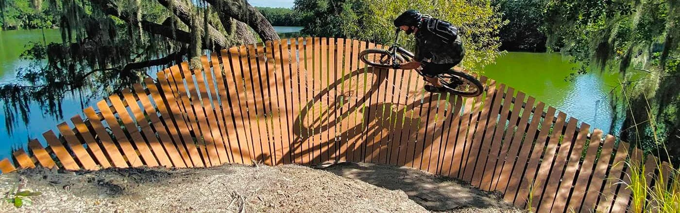 A bike-park berm over a reclaimed lake in Mulberry